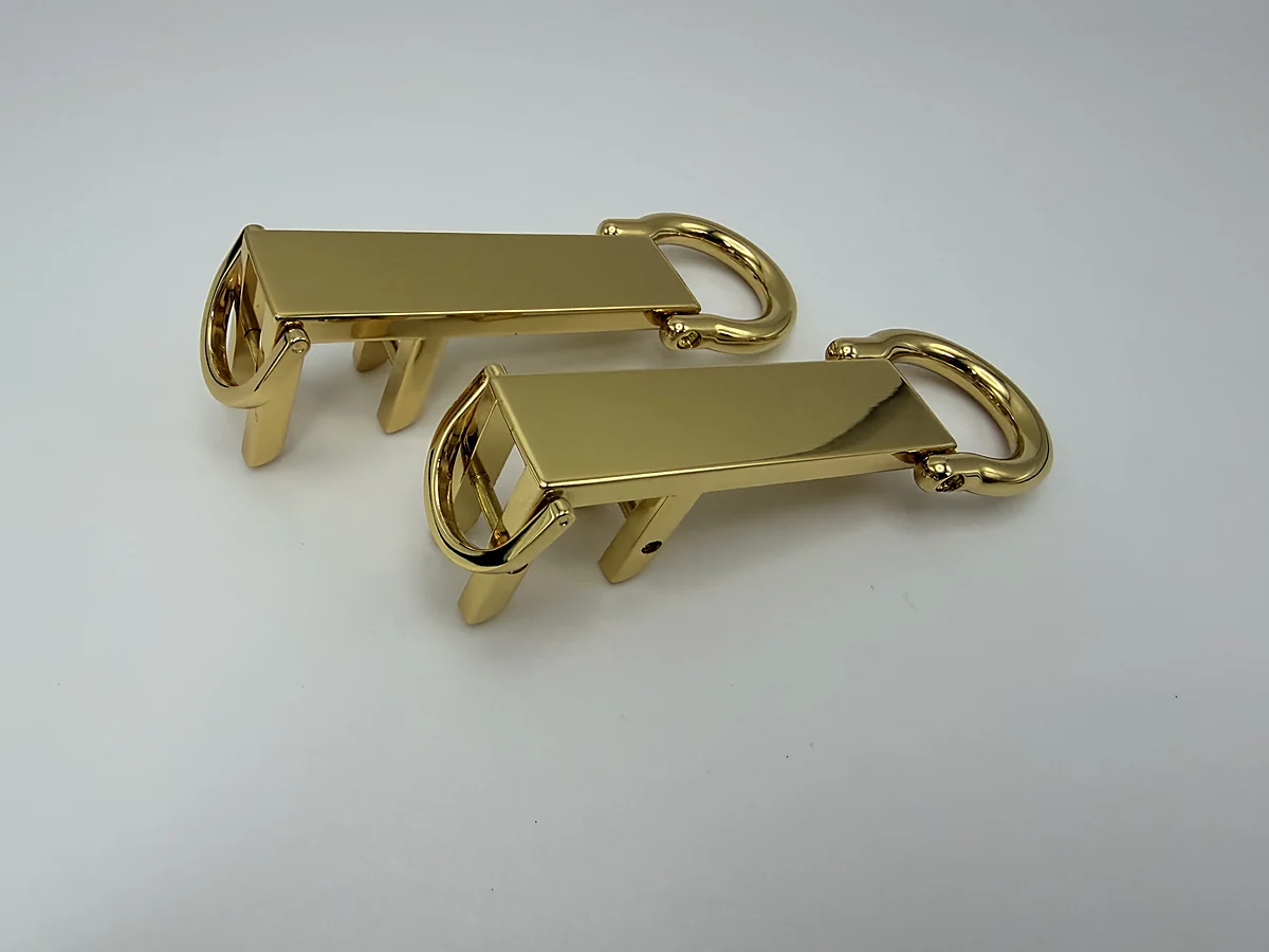 Second view of gold handle attachment fittings