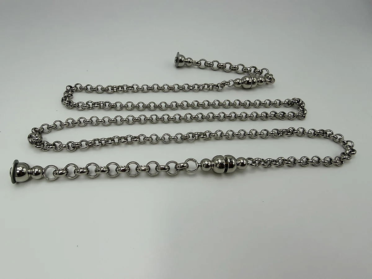 Long silver chain assembly arranged in parallel rows