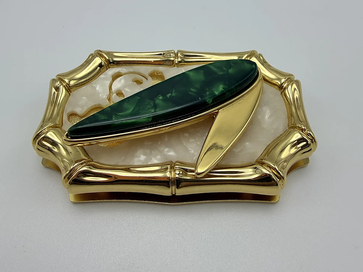 Sculpted gold decorative hardware sample in a finish guide
