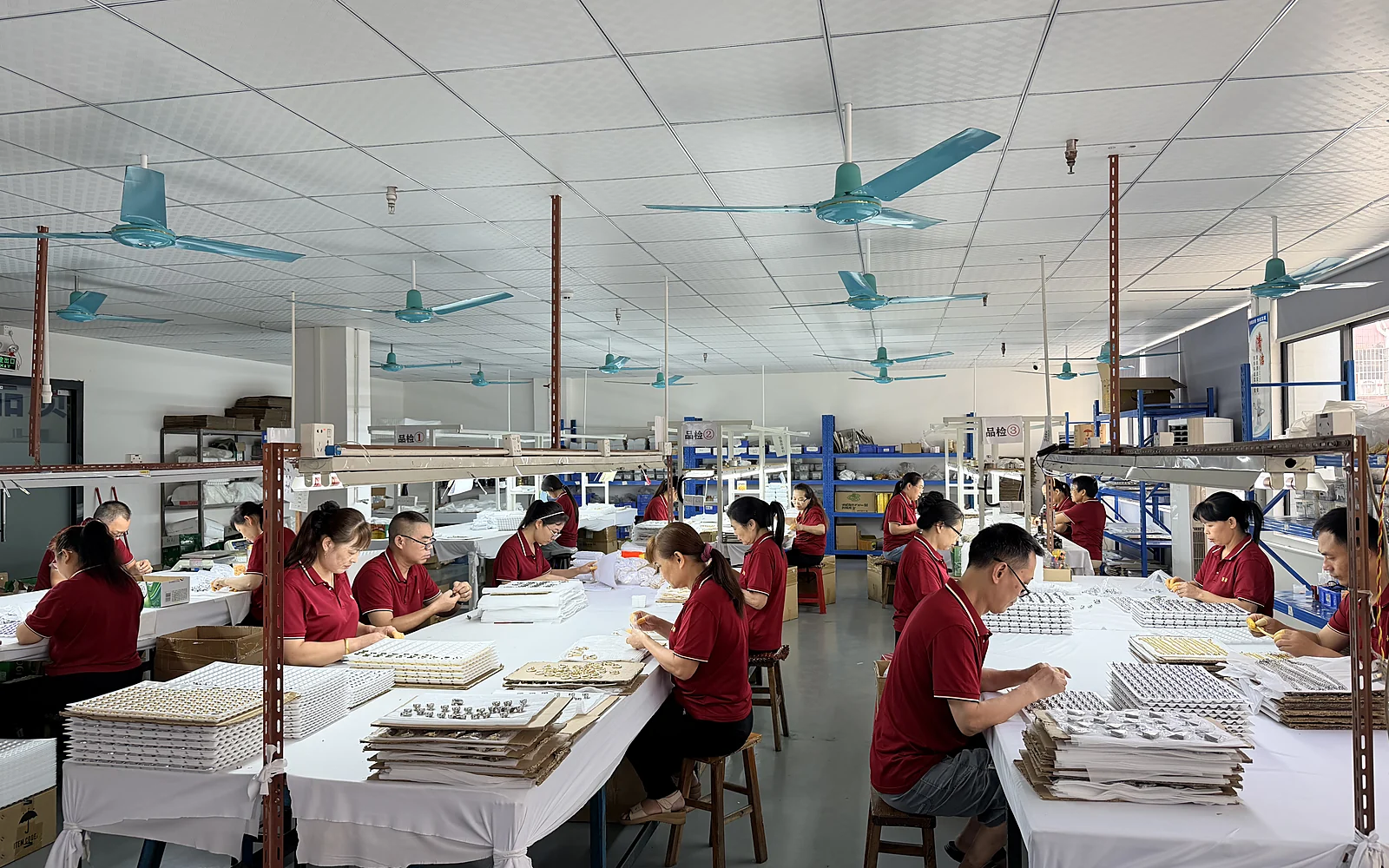 Zhenglin factory team inspecting and arranging metal hardware components in Dongguan