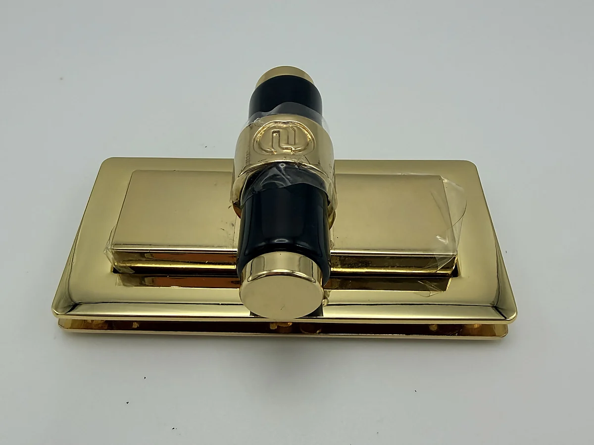 Gold rectangular slide lock with a dark centre bar